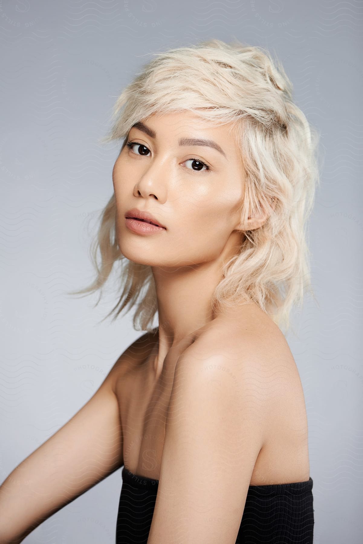 a model poses with platinum blonde hair