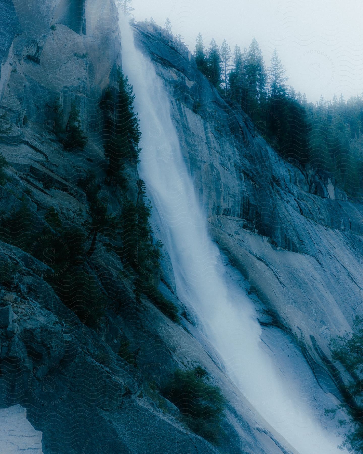 A waterfall running down the side of a cliff