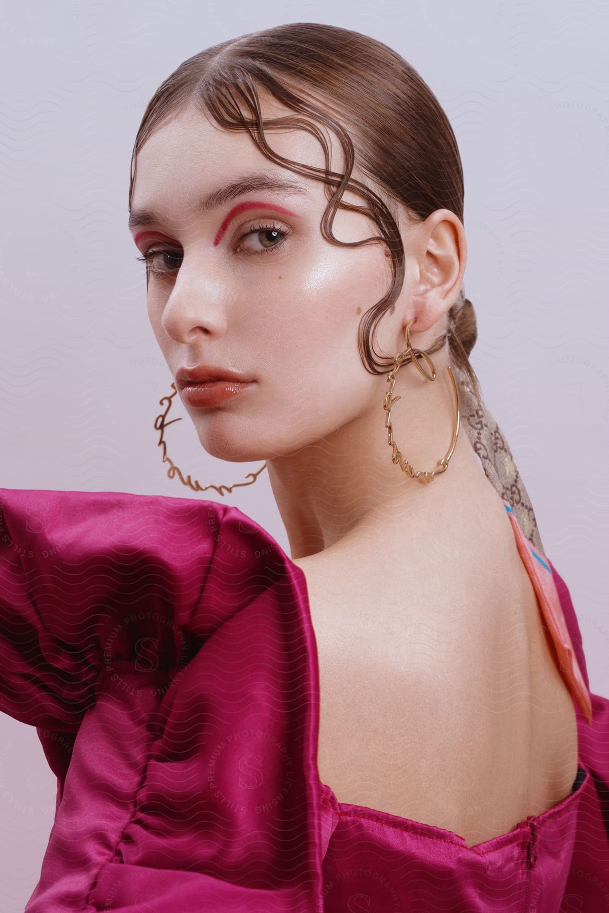 A portrait of a woman in a room while wearing fashionable clothes