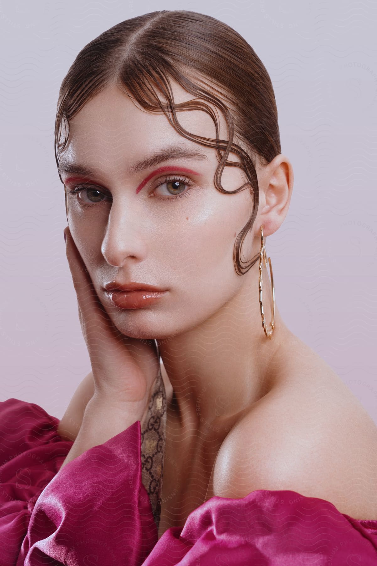 Close up of woman wearing eyeshadow that matches her clothes