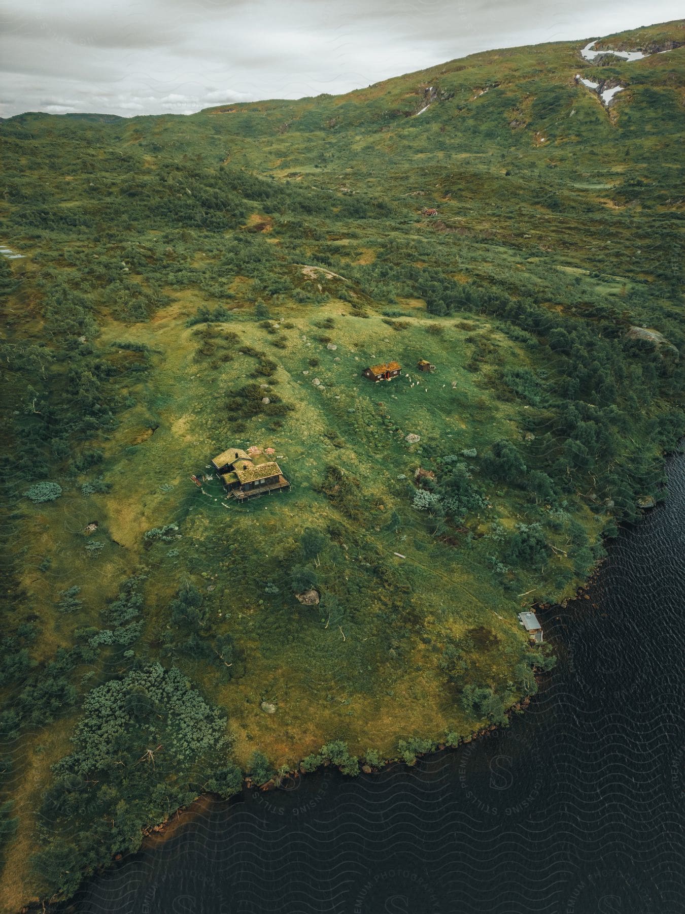 An ariel view of a home with a large amount of farm land.