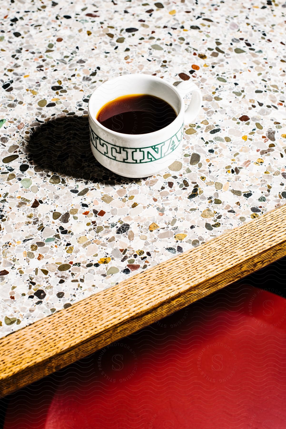 a filled espresso cup rests on a counter