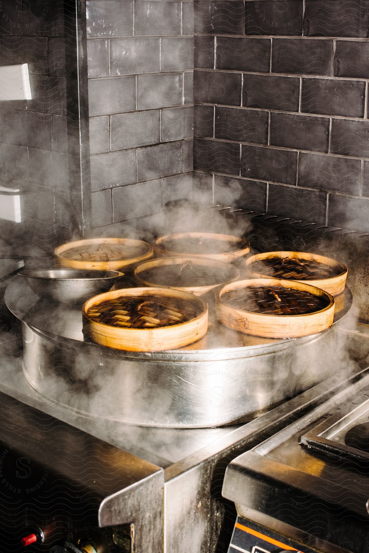 Food being prepared in wooden steamers.