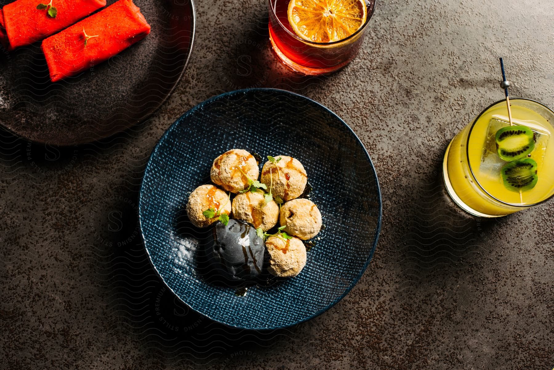 Cream ice cream balls in a blue bowl.