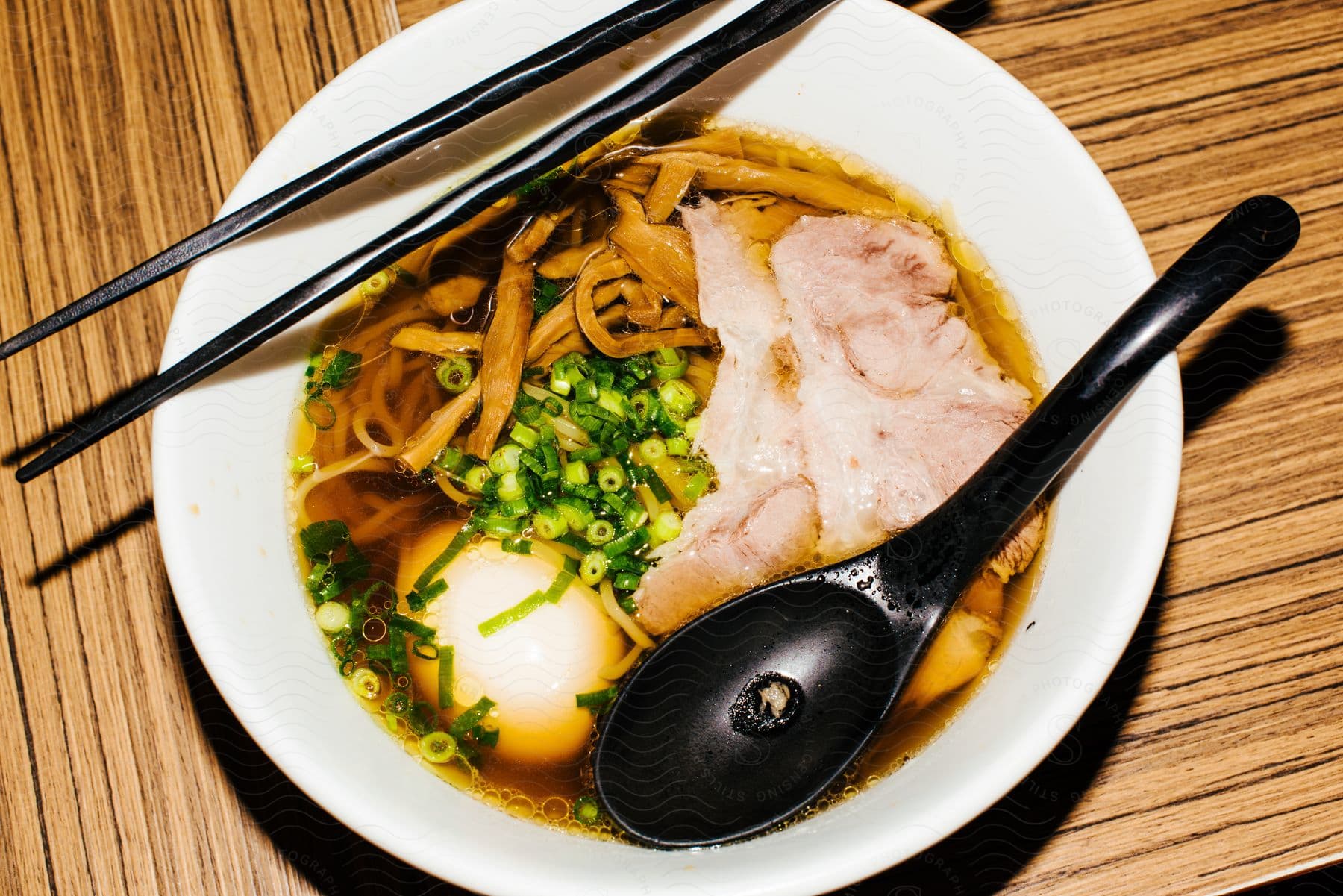 An Asian soup dish with noodles and broth.