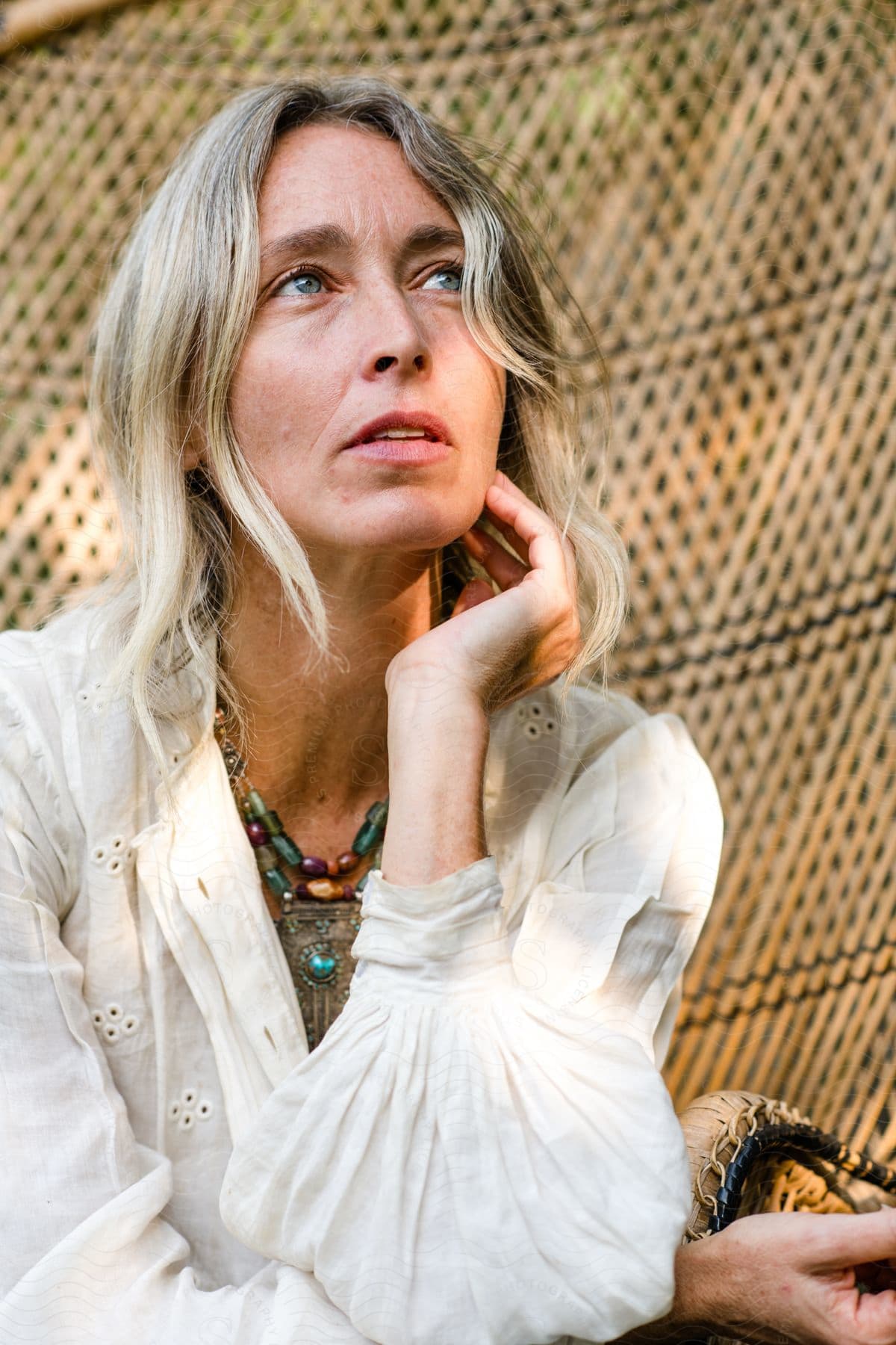 Portrait of a thoughtful woman with blue eyes.