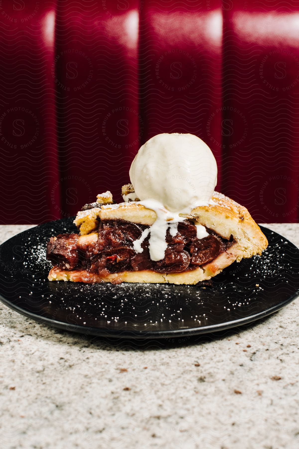 Black plate with Blueberry Apple Strudel.