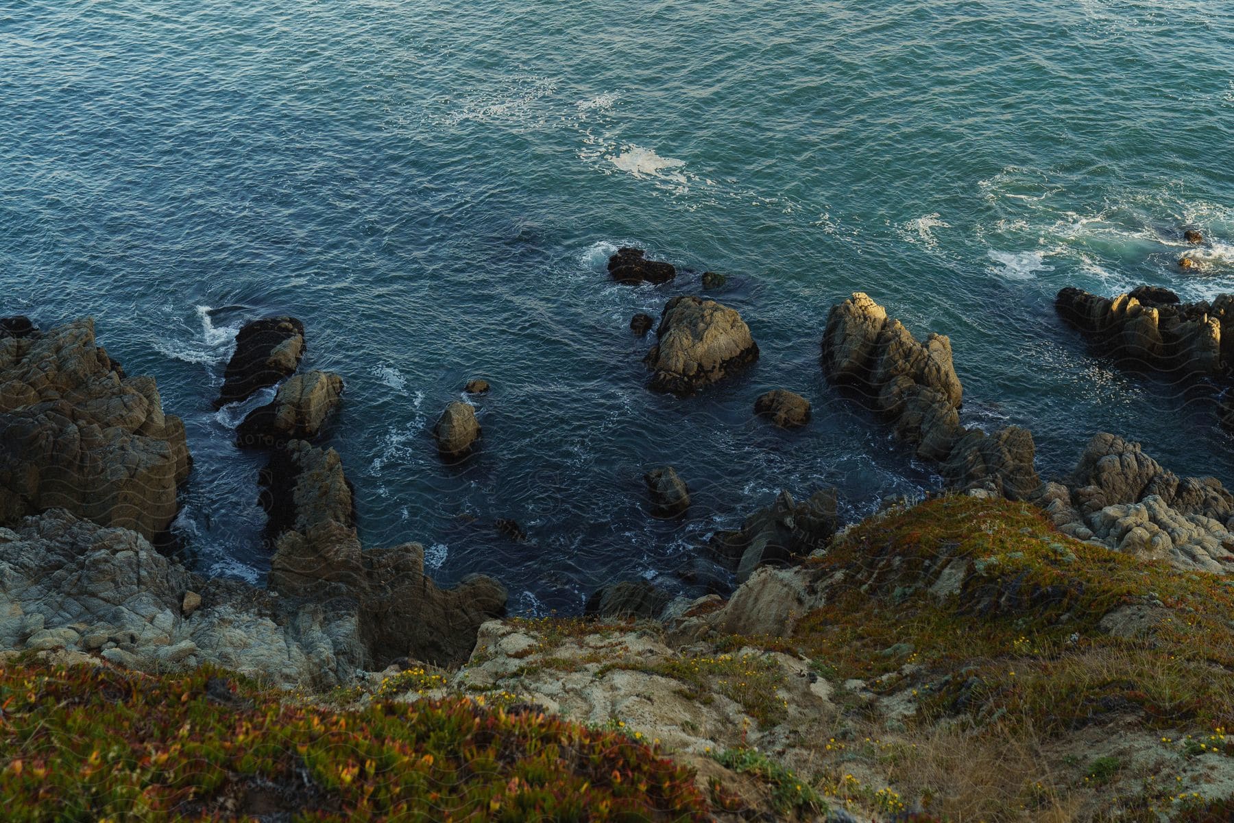 Aerial of mountainous beach coast.