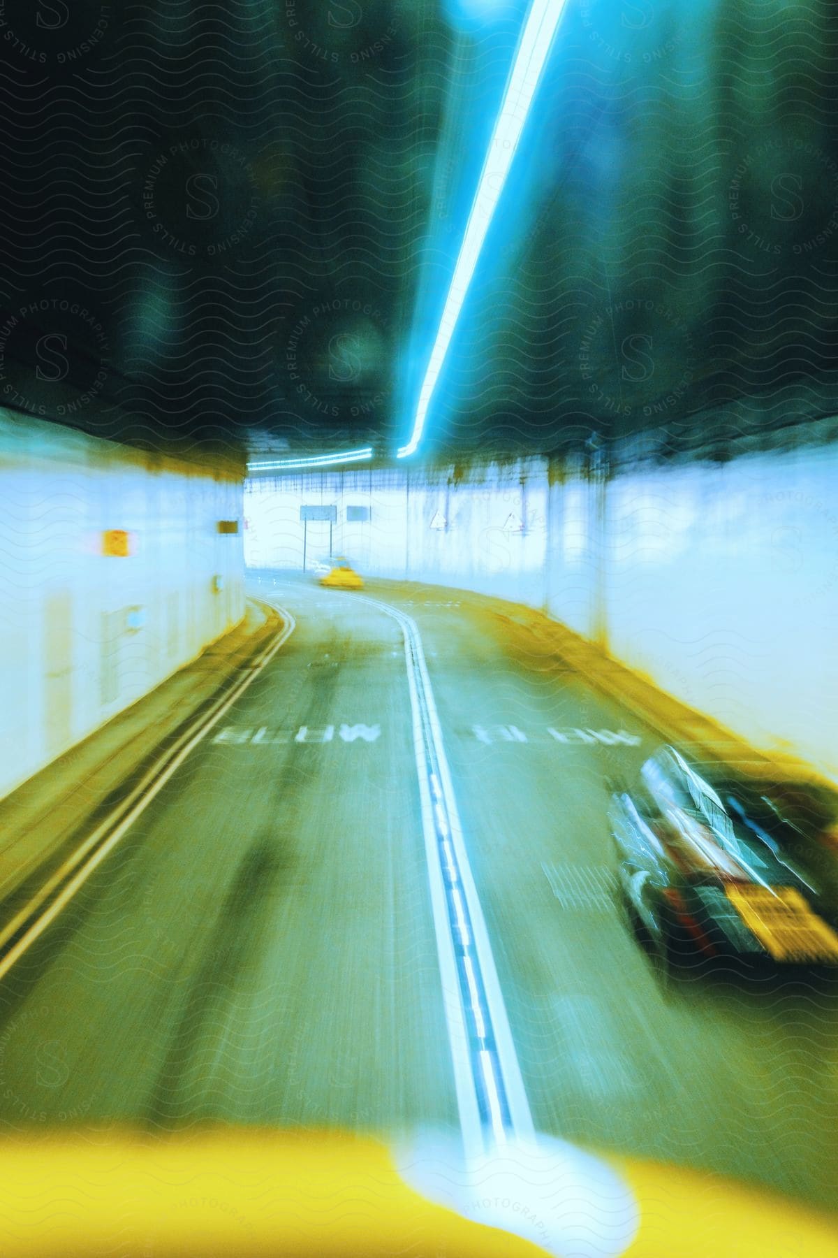 Some cars driving through a tunnel