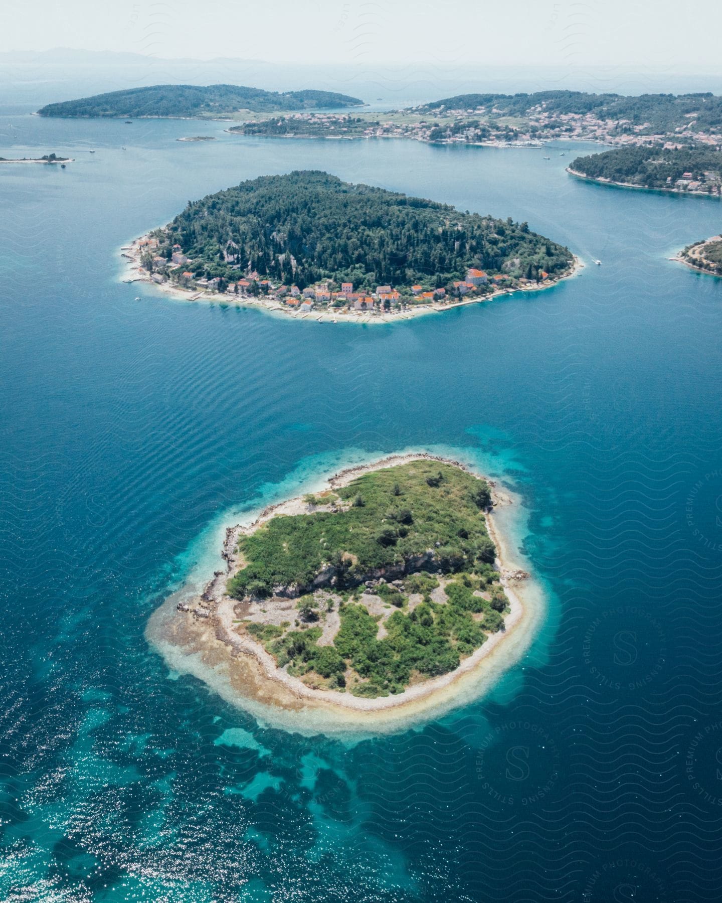 A group of small islands covered in trees and grass.