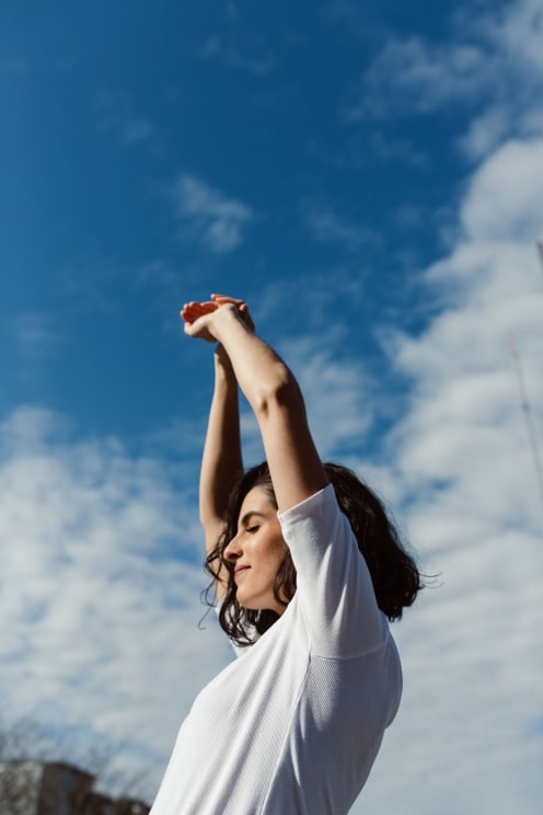 Woman Stretching Her Arms Upward
