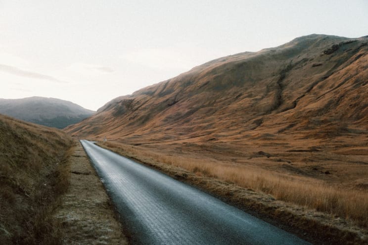 Panorama Of A Road Amid The Mountains