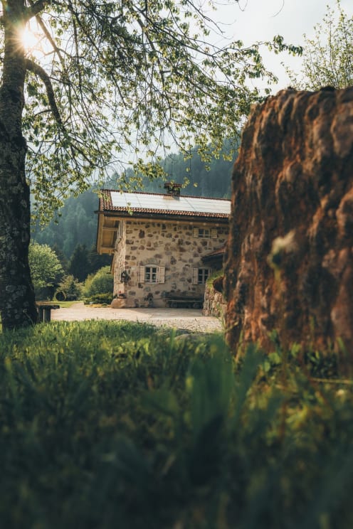 A Farmhouse Outdoors On A Sunny Day