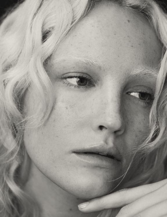 A Portrait Of A Woman's Face Outdoors