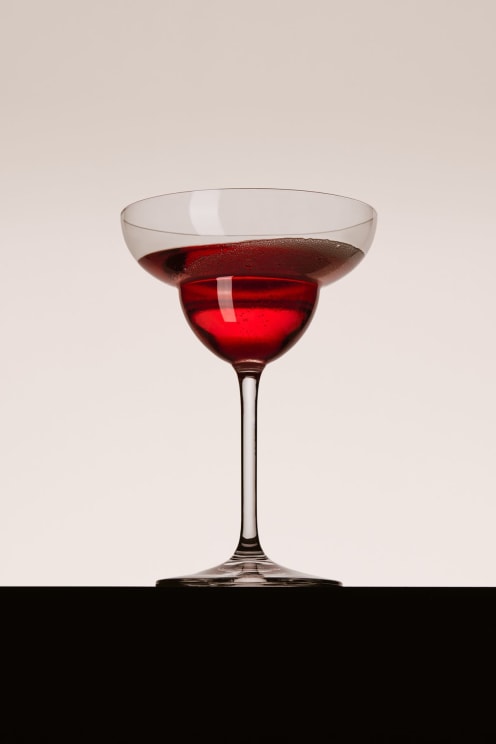 A Red Liquid In A Margarita Cocktail Glass