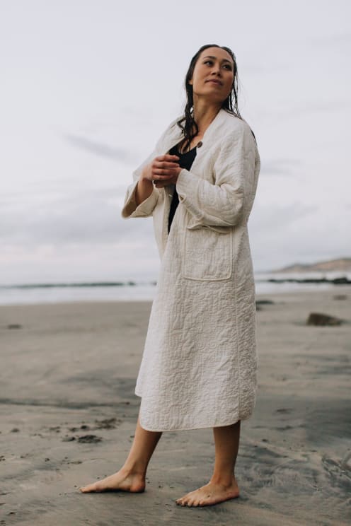 A Portrait Of A Woman Standnig Outdoors