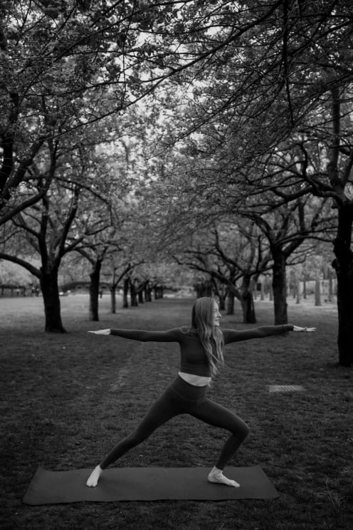 A Woman Doing Yoga In The Park