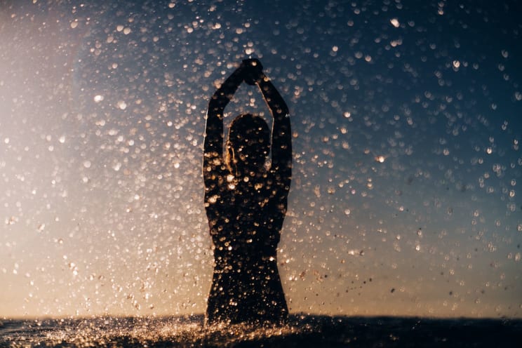 A Woman Swimming In The Ocean