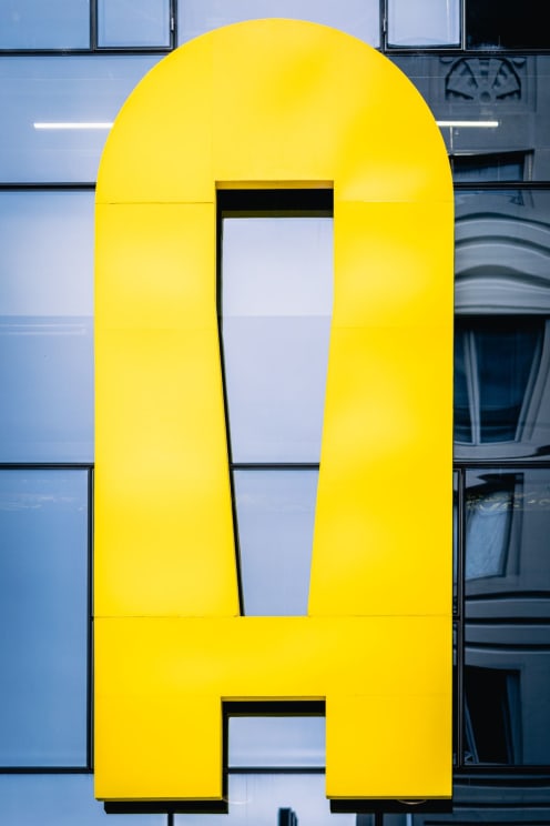A Yellow Letter A On The Side Of A Building