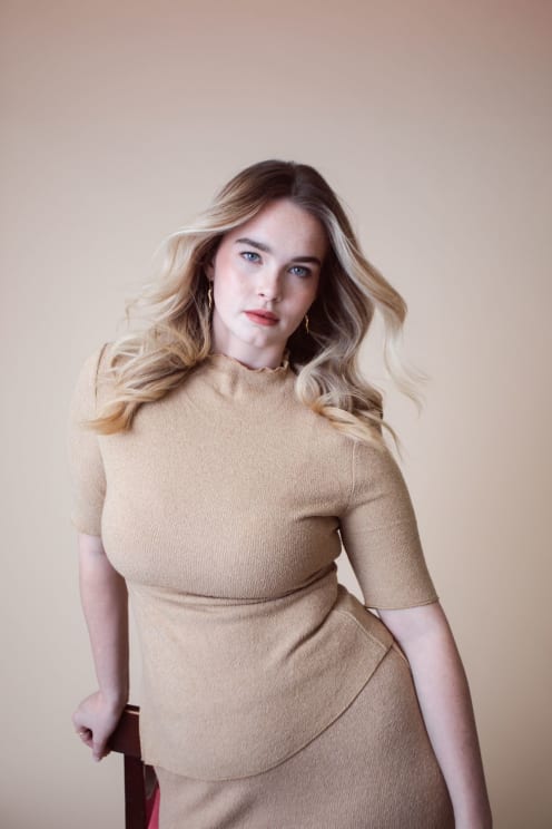 A Woman Wearing A Burgendry Dress