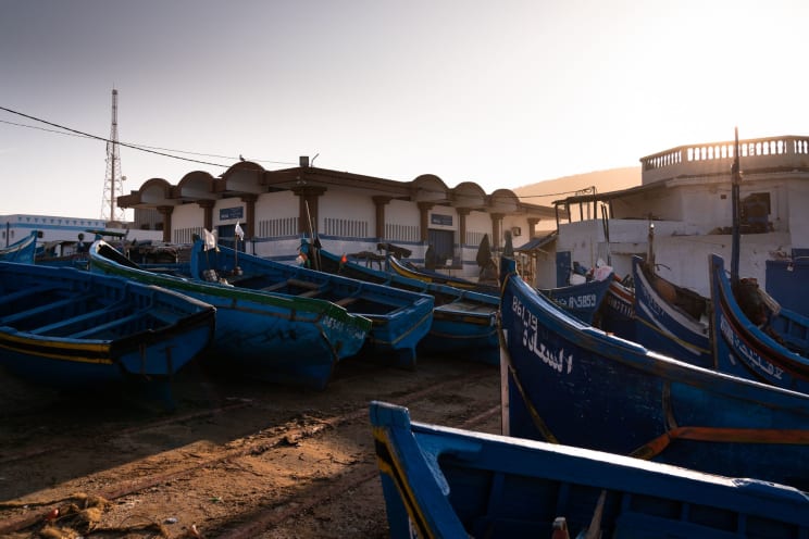 Blue Fishing Boats Moored In A Port At Dusk