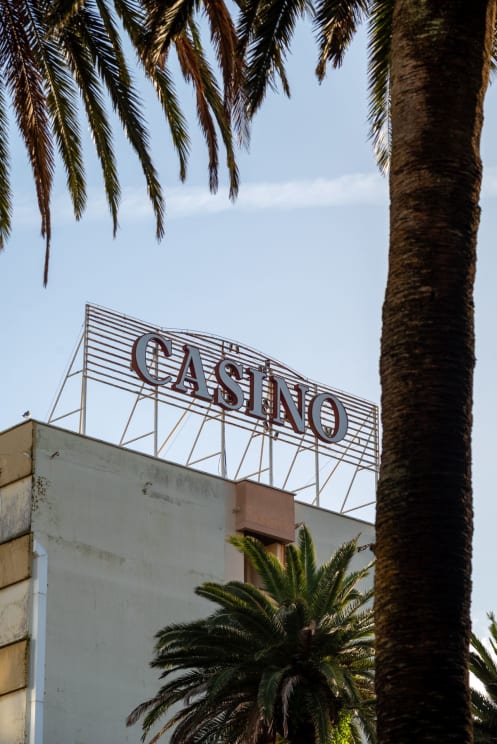 A Casino Sign Atop A Building