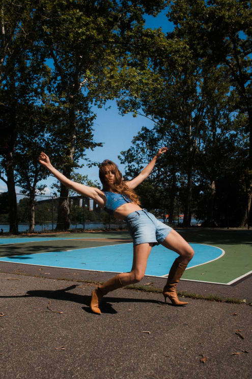 A Woman Poses In A Silly Way