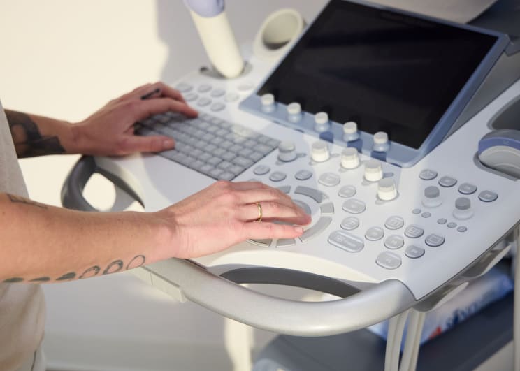 A Person Operating A Medical Equipment