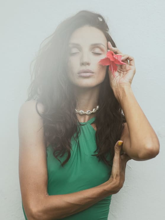 Woman With Closed Eyes, Holding A Red Flower Delicately