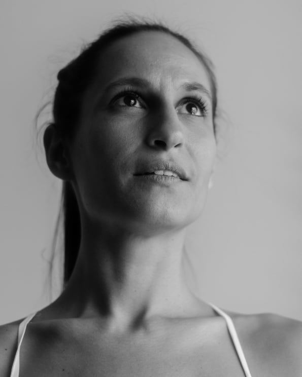 A Young Lady Wearing Spaghetti Strap Top Looking Up
