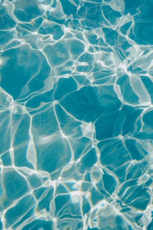 Sunlight Reflects Off Blue Ocean Water On A Sunny Day