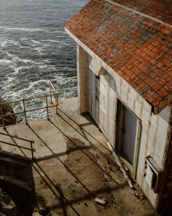 Roof And Outer Wall Of A House On The Sea At Sunset