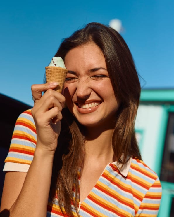 A Woman Holding An Ice Cream Cone