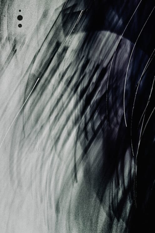 Black And Dark Grey Blurs Against The White Backdrop