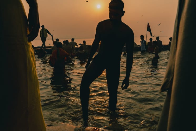 Silhouette Of People In A Natural Pool