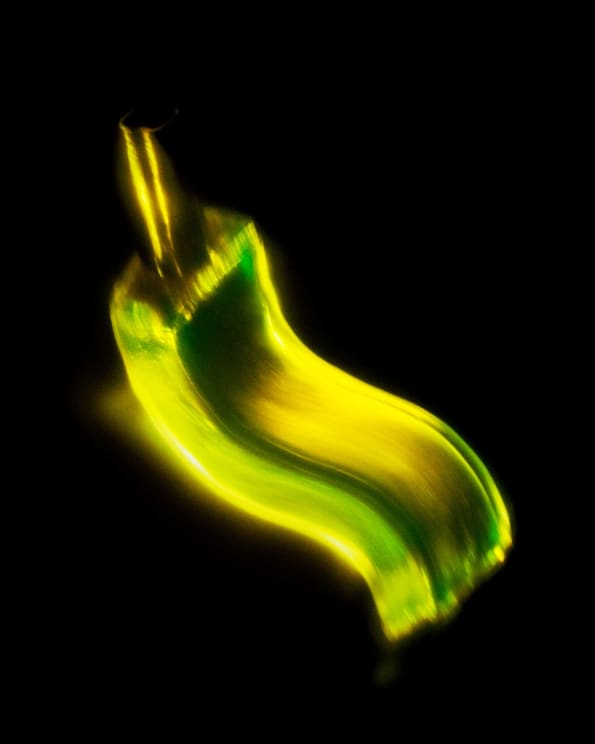 A Yellow And Green Lit Shape