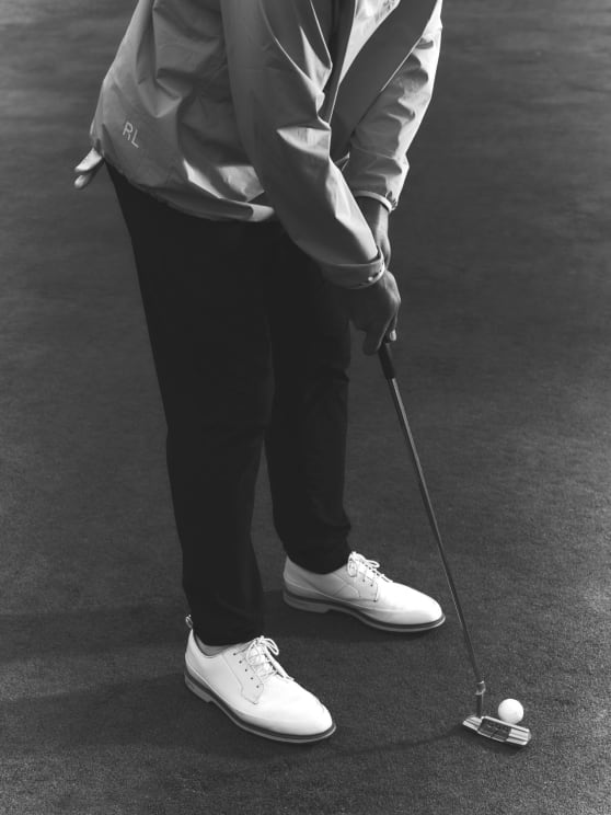 A Person Putting Outdoors
