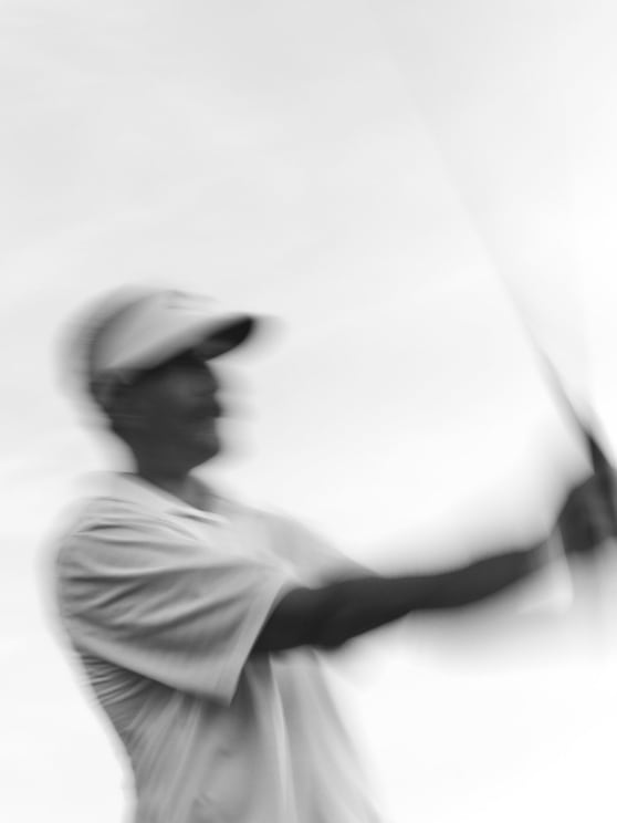 Man Swings His Golf Club Into The Air