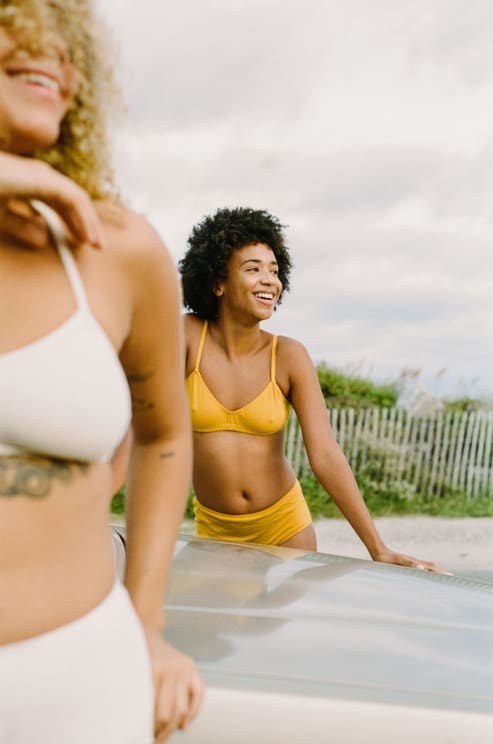 Two Women Standing Outdoors