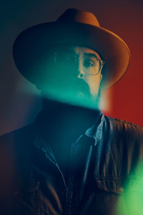 One Person Wearing A Hat And Sunglasses