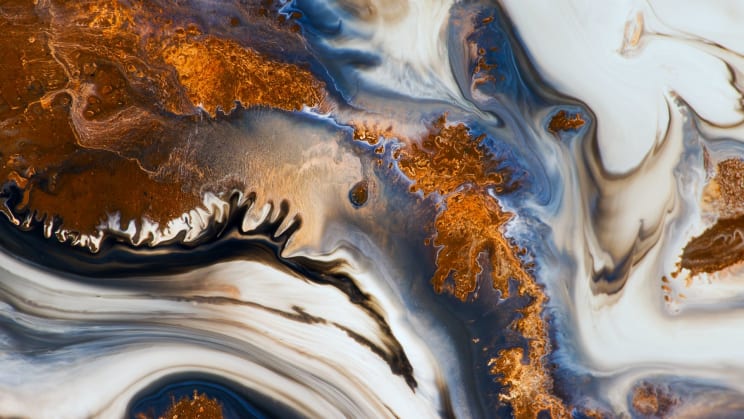 White Smoky Liquid Fills The Space Between Gold Leaf Pieces