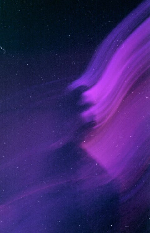Purple And Hot Pink Glowing Stripes Streak Across The Darkness