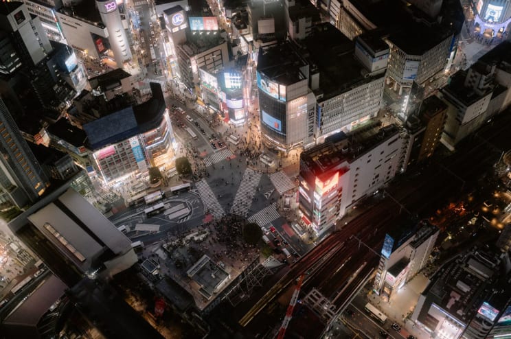 Tokyo Cityscape With Modern Buildings Bustling Streets And Illuminated Lights At Night