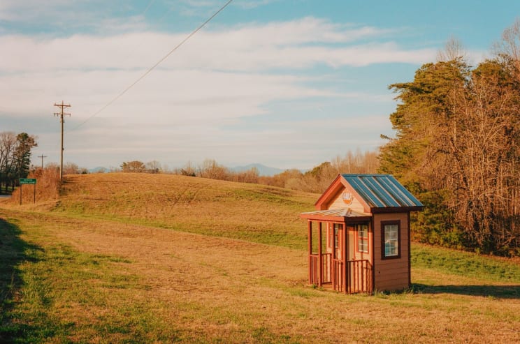 A Small Cabin In A Rural Region With Plains