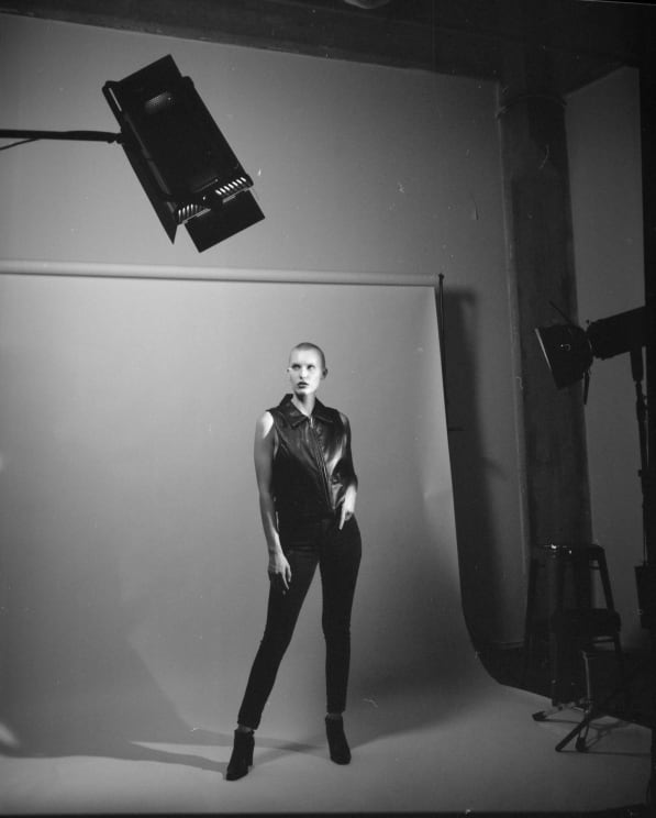 A Young Woman Wearing Leather Clothing Posing For A Photo