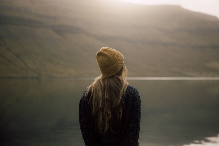 A Woman Stands In An Outdoor Setting