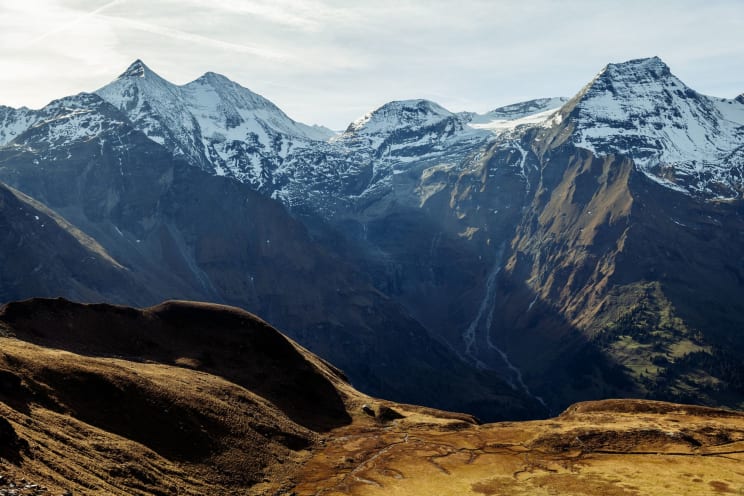 Mountain Tops On A Sunny Day In The Alps Region