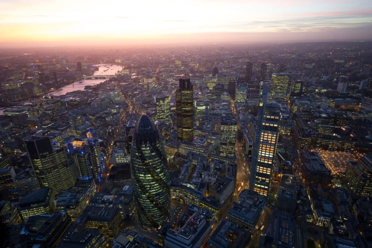 Aerial Shot Of A Sunset Behind A Large Urban Landscape