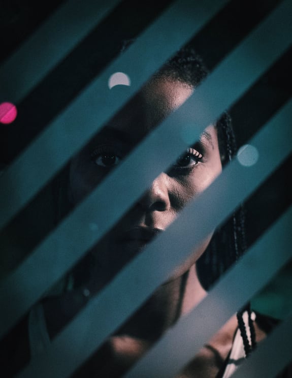 Woman Standing Near A Window