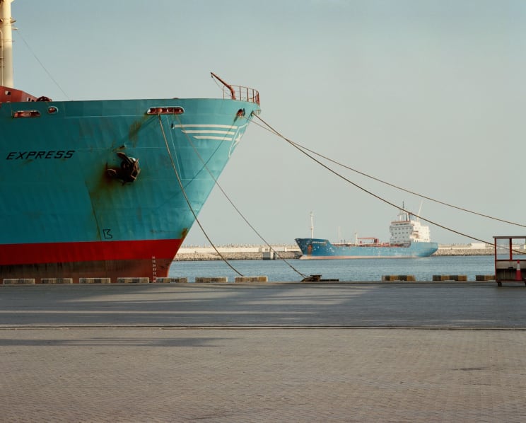 Cargo Ships Moored To Piers